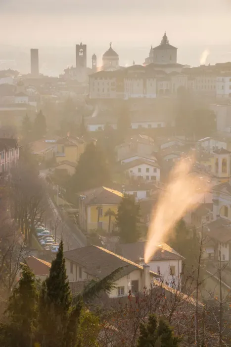 Framed Print : A cold morning in Bergamo upper town with some fog and smoke from the chimneys Framed Print : A cold morning in Bergamo upper town with some fog and smoke from the chimneys