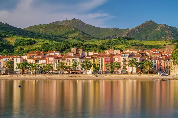Framed Print : Collioure reflecting in bay, Pyrenees Orientales, Occitanie Region, France