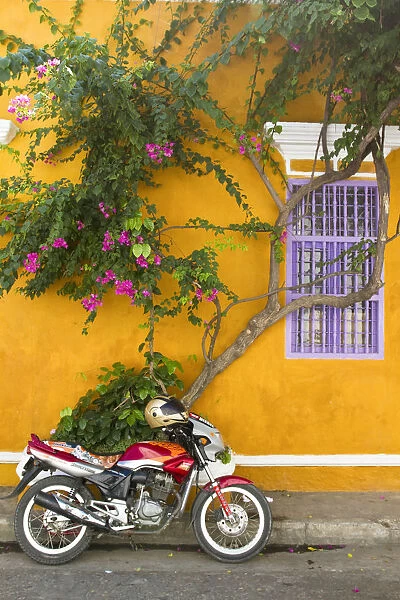 Colombia, Bolivar, Cartagena De Indias, Motobike outside colonial house