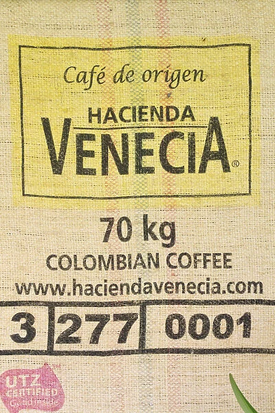 Colombia, Caldas, Manizales, Hacienda Venecia Coffee plantation, Coffee sack on wall