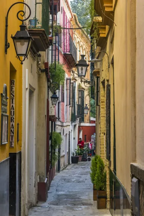 Framed Print : Colorful alley in Santa Cruz neighborhood, Seville, Andalusia, Spain Framed Print : Colorful alley in Santa Cruz neighborhood, Seville, Andalusia, Spain