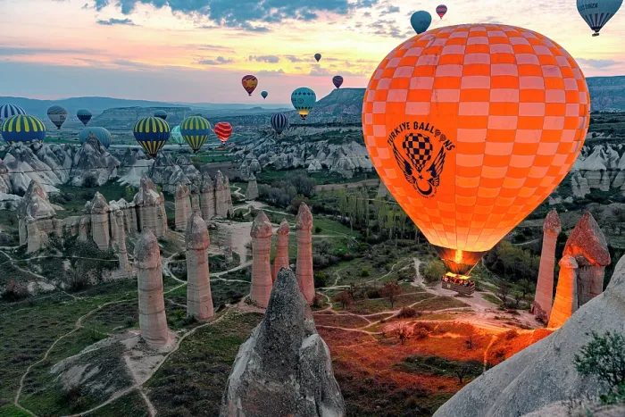 Framed Print : Colorful hot air balloons rising over rock formations at sunrise, Love Valley, Goreme National Park, Cappadocia, Central Anatolia, Turkey Framed Print : Colorful hot air balloons rising over rock formations at sunrise, Love Valley, Goreme National Park, Cappadocia, Central Anatolia, Turkey