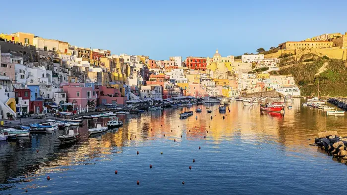 Framed Print : Colorful houses in the fishing village of La Corricella at sunset, Procida island, Gulf of Naples, Campania, Italy Framed Print : Colorful houses in the fishing village of La Corricella at sunset, Procida island, Gulf of Naples, Campania, Italy