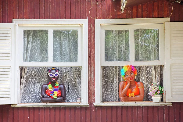 Colorful mannequins at the window of a local house, Vila do Abraao, Ilha Grande, Angra dos Reis, Rio de Janeiro, Brazil