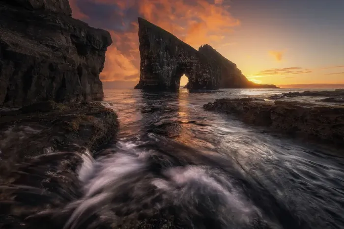 Framed Print : Colorful sunset behind the cliffs of Drangarnir after the storm cleared. Vagar, Faroe Islands Framed Print : Colorful sunset behind the cliffs of Drangarnir after the storm cleared. Vagar, Faroe Islands