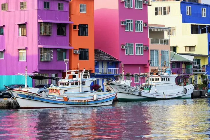 Framed Print : Colourful buildings and fishing boats at Gushan Harbour, Kaohsiung, Taiwan