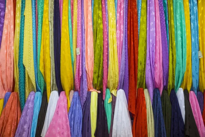 Framed Print : Colourful cotton fabrics for sale in Souk Waqif, Doha, Qatar Framed Print : Colourful cotton fabrics for sale in Souk Waqif, Doha, Qatar