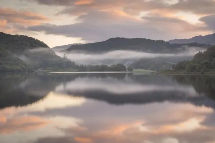 Framed Print : Colourful dawn sky above a reflective and misty Llyn Dinas, Snowdonia National Park