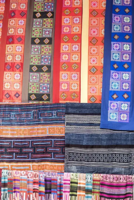 Framed Print : Colourful fabrics hanging in a market, Sapa; Sa Pa District; Lao Cai Province; Vietnam Framed Print : Colourful fabrics hanging in a market, Sapa; Sa Pa District; Lao Cai Province; Vietnam
