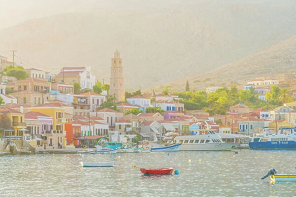 The colourful harbour and Saint Nicholas church in the background, Halki, Chalki, Dodecanese Islands, Greece