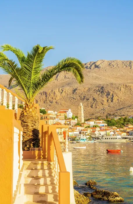 Framed Print : The colourful harbour and Saint Nicholas church in the background, Halki, Chalki, Dodecanese Islands, Greece Framed Print : The colourful harbour and Saint Nicholas church in the background, Halki, Chalki, Dodecanese Islands, Greece