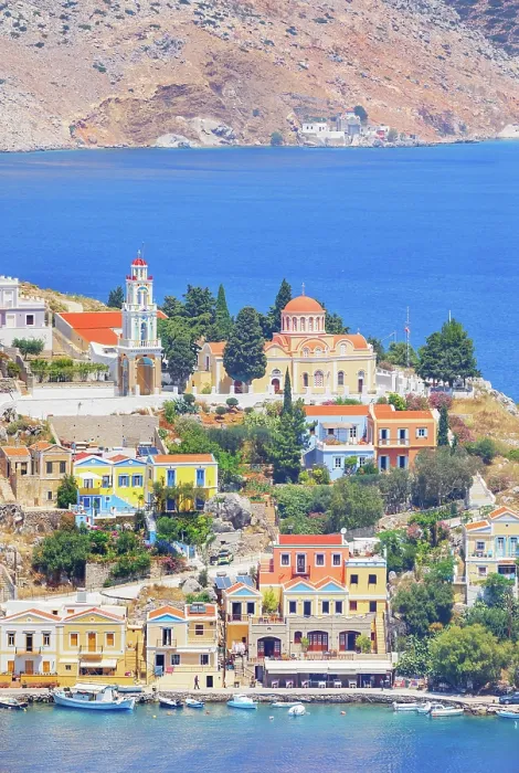 Framed Print : Colourful houses and Evangelismos church at the Harani Bay, Gialos, Symi Island, Dodecanese Islands, Greece Framed Print : Colourful houses and Evangelismos church at the Harani Bay, Gialos, Symi Island, Dodecanese Islands, Greece