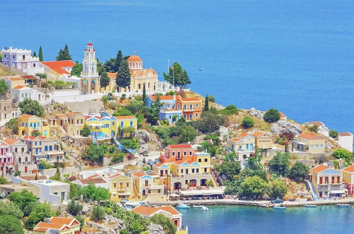Framed Print : Colourful houses and Evangelismos church at the Harani Bay, Gialos, Symi Island, Dodecanese Islands, Greece