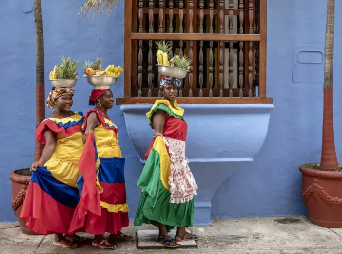 Framed Print : Colourful Palenqueras selling fruits on the street of Cartagena, Bolivar Department Framed Print : Colourful Palenqueras selling fruits on the street of Cartagena, Bolivar Department