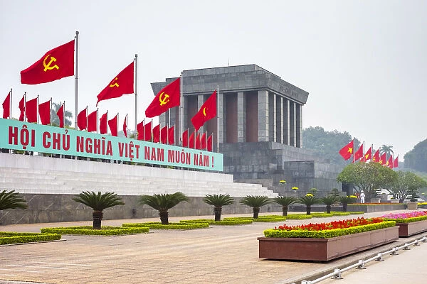 Communist flags fly outside of Ho Chi Minh Mausoleum on Ba Dinh Square, Hanoi, Vietnam