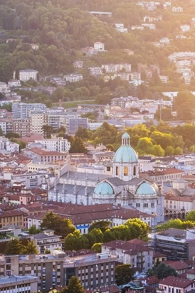 Como, Lombardy, Italy. High angle view over the city and the Como Cathedral at sunset