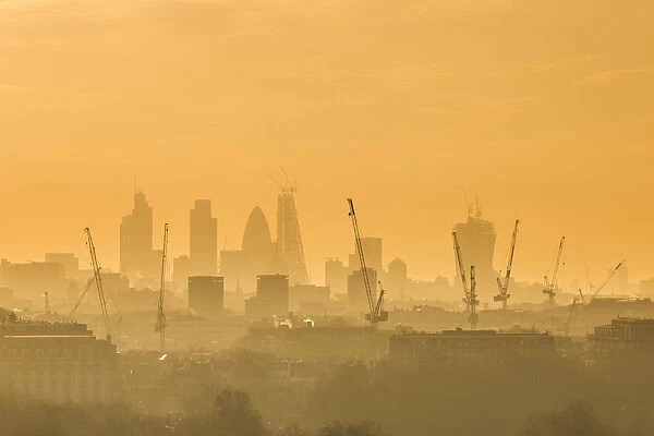 Construction cranes and City of London Skyline, London, England, UK