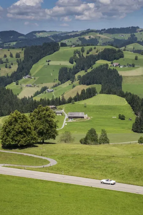Framed Print : Convertible car on winding road in the Emmental Valley, Berner Oberland, Switzerland Framed Print : Convertible car on winding road in the Emmental Valley, Berner Oberland, Switzerland