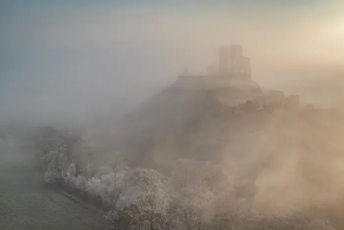 Framed Print : Corfe Castle emerging from mist on a frosty wintry morning, Dorset, England. Winter (February) 2023 Framed Print : Corfe Castle emerging from mist on a frosty wintry morning, Dorset, England. Winter (February) 2023