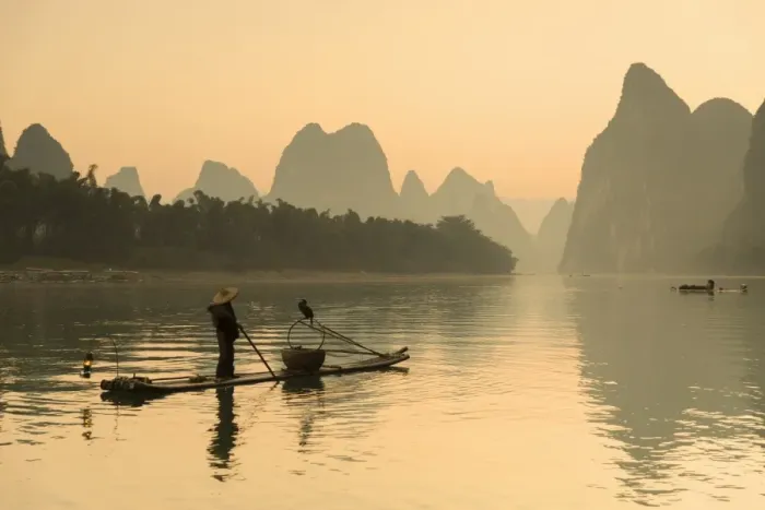 Framed Print : Cormorant fisherman on Li River at dawn, Xingping, Yangshuo, Guangxi, China Framed Print : Cormorant fisherman on Li River at dawn, Xingping, Yangshuo, Guangxi, China
