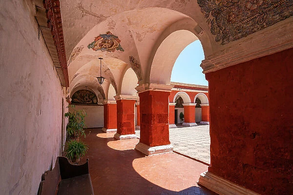 Corridor with red walls and columns at Monastery of Santa Catalina de Siena, UNESCO, Arequipa, Arequipa Province, Arequipa Region, Peru