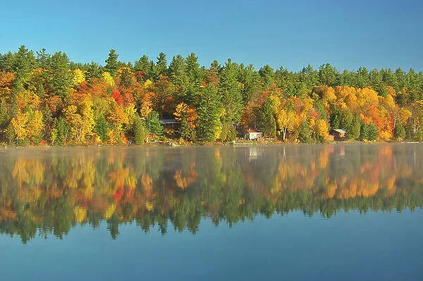 Cottages and Autumn colors along Carlyle Lake Killarney Provincial Park, Ontario, Canada