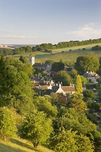 Cottages nestled into the valley in the picturesque Cotswolds village of Naunton