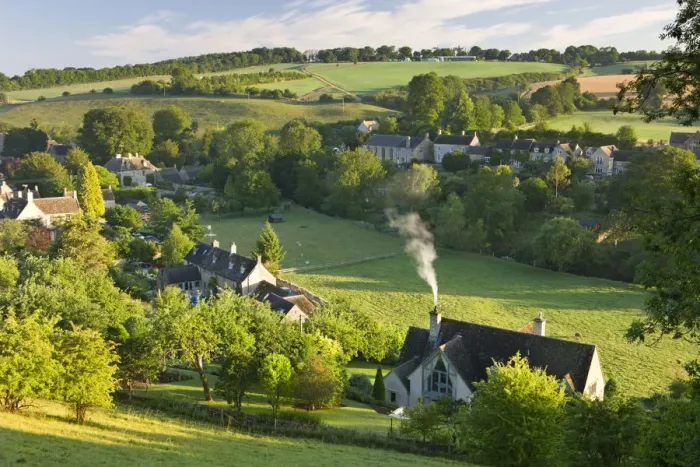 Framed Print : Cottages nestled into the valley in the picturesque Cotswolds village of Naunton Framed Print : Cottages nestled into the valley in the picturesque Cotswolds village of Naunton