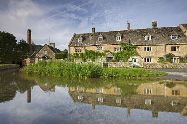 Cottages and old mill beside the River Eye in the Cotswolds village of Lower Slaughter