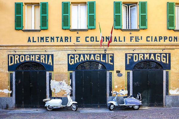 Couple of Lambretta Innocenti scooter parked at the old grocery, Morbegno, province