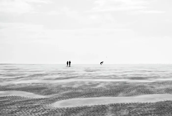 Framed Print : A couple playing with their dog on the vast expanse of Whiteford Sands beach, Gower Peninsula, Swansea, Wales Framed Print : A couple playing with their dog on the vast expanse of Whiteford Sands beach, Gower Peninsula, Swansea, Wales