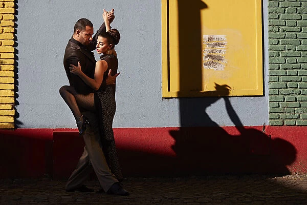 A couple of Professional Tango dancers in the colorful 'Caminito de la Boca', Buenos Aires, Argentina. (MR)