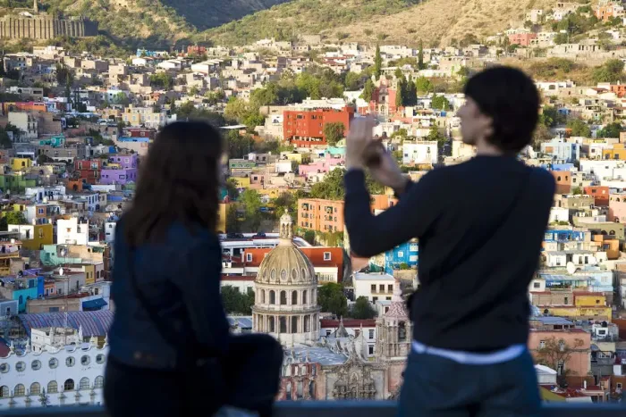 Framed Print : Couple taking picture over Guanajuato, Guanajuato state, Mexico Framed Print : Couple taking picture over Guanajuato, Guanajuato state, Mexico