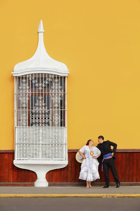 Framed Print : A couple of traditional Marinera'dancers in front of a colonial architecture window of the Plaza de Armas'in Trujillo, La Libertad, Peru. Marinera is the Peruvian National dance. (MR) Framed Print : A couple of traditional Marinera'dancers in front of a colonial architecture window of the Plaza de Armas'in Trujillo, La Libertad, Peru. Marinera is the Peruvian National dance. (MR)
