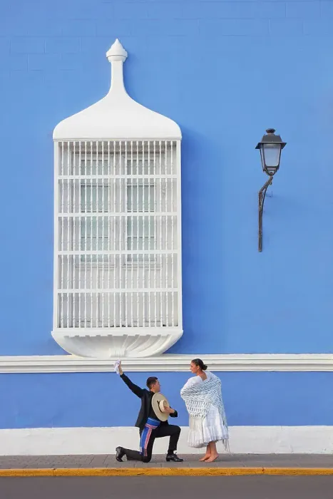 Framed Print : A couple of traditional Marinera'dancers in front of a colonial architecture window of the Plaza de Armas'in Trujillo, La Libertad, Peru. Marinera is the Peruvian National dance. (MR) Framed Print : A couple of traditional Marinera'dancers in front of a colonial architecture window of the Plaza de Armas'in Trujillo, La Libertad, Peru. Marinera is the Peruvian National dance. (MR)
