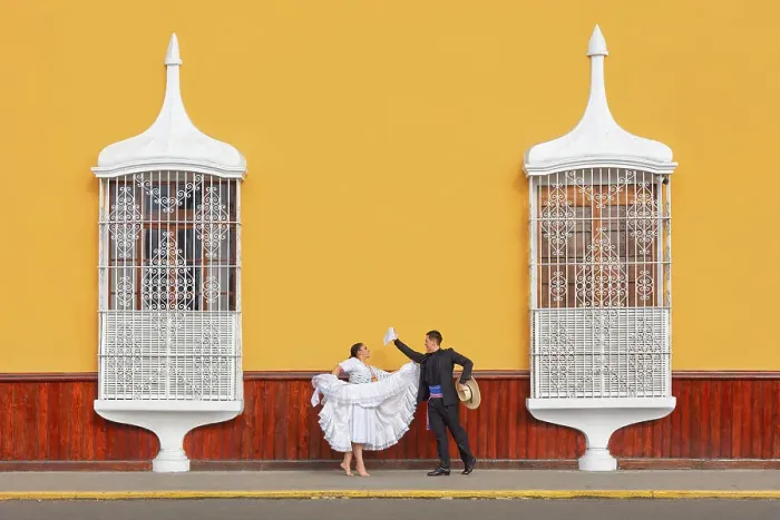 Framed Print : A couple of traditional Marinera'dancers in front of colonial architecture windows of the Plaza de Armas'in Trujillo, La Libertad, Peru. Marinera is the Peruvian National dance. (MR) Framed Print : A couple of traditional Marinera'dancers in front of colonial architecture windows of the Plaza de Armas'in Trujillo, La Libertad, Peru. Marinera is the Peruvian National dance. (MR)