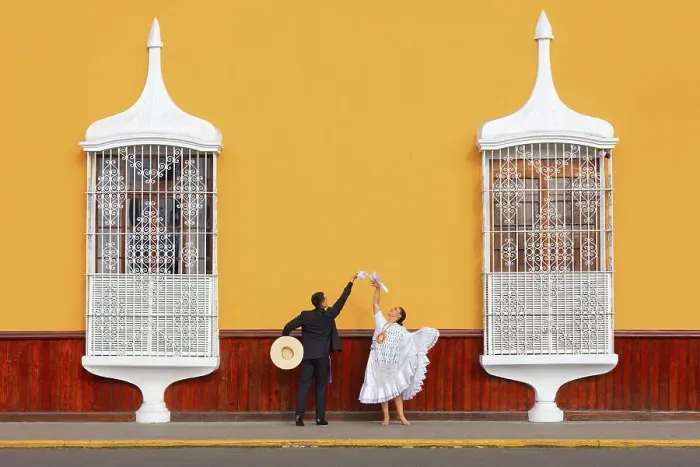 Framed Print : A couple of traditional Marinera'dancers in front of colonial architecture windows of the Plaza de Armas'in Trujillo, La Libertad, Peru. Marinera is the Peruvian National dance. (MR) Framed Print : A couple of traditional Marinera'dancers in front of colonial architecture windows of the Plaza de Armas'in Trujillo, La Libertad, Peru. Marinera is the Peruvian National dance. (MR)