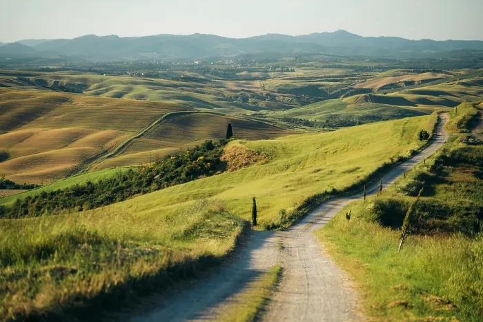 Framed Print : Crete Senesi, Tuscany, Italy: Winding road through rolling hills and farmland Framed Print : Crete Senesi, Tuscany, Italy: Winding road through rolling hills and farmland
