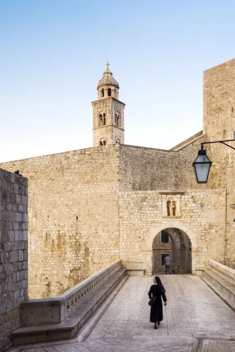 Framed Print : Croatia, Dubrovnik, Nun walking through the old town Framed Print : Croatia, Dubrovnik, Nun walking through the old town