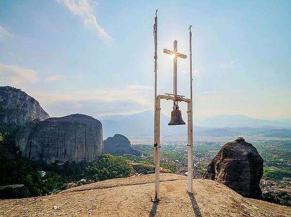 Cross with a bell at the top of the Holy Spirit Rock, Meteora, Thessaly, Greece