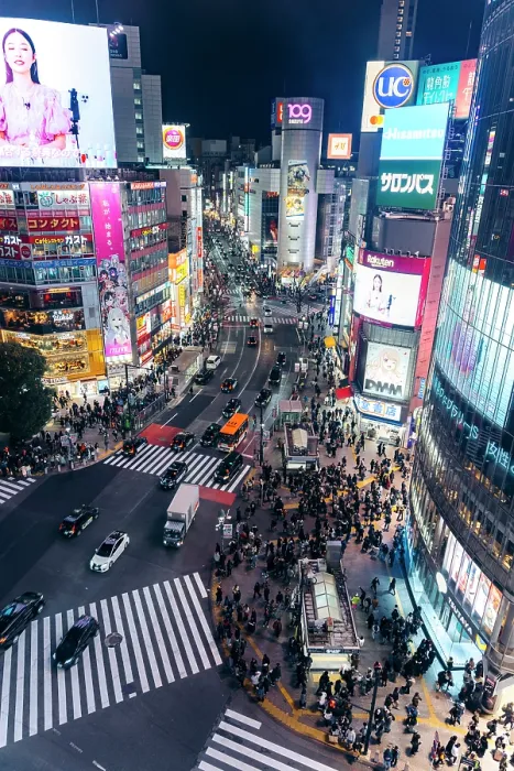 Framed Print : Crowds cross Shibuya Crossing, Tokyo, at night, illuminated by bright billboards Framed Print : Crowds cross Shibuya Crossing, Tokyo, at night, illuminated by bright billboards