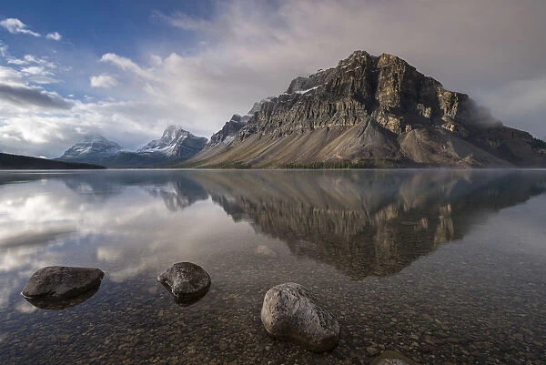 Crowfoot mountain reflection in the mirror still waters of Bow Lake, Banff National Park