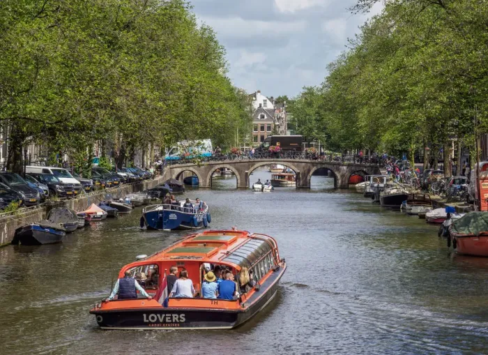 Framed Print : Cruise Boat on Herengracht Canal in Amsterdam, North Holland, The Netherlands Framed Print : Cruise Boat on Herengracht Canal in Amsterdam, North Holland, The Netherlands
