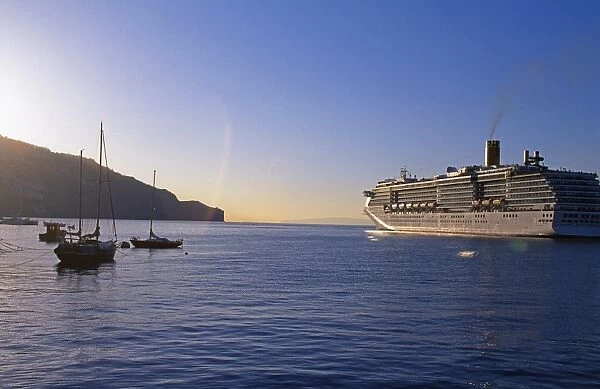Cruise ship leaving Funchal Harbour at sunset