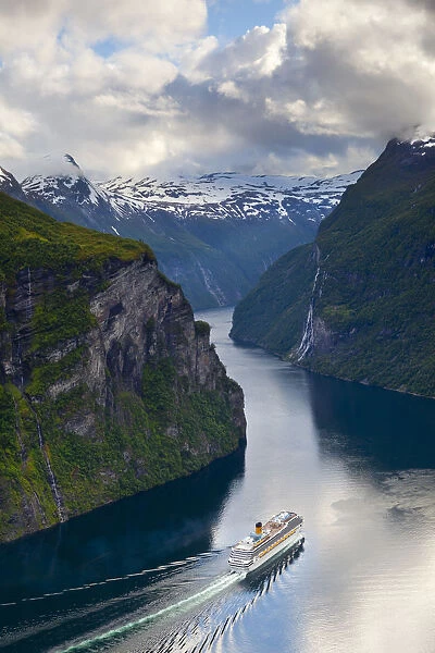 A Cruise Ship navigates through a bend in the dramatic Geiranger Fjord, Geiranger