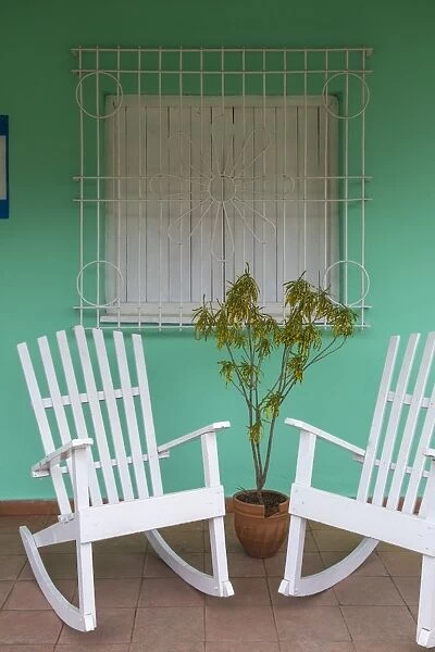 Cuba, Pinar del Rio Province, Vinales, Vinales town, Rocking chairs outside house