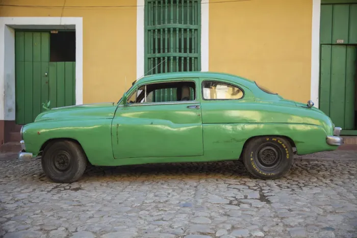 Framed Print : Cuba, Trinidad, Classic American car in historical center