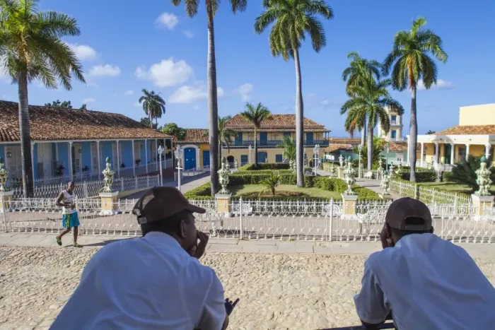 Framed Print : Cuba, Trinidad, Two Security guards look across Plaza Mayor Framed Print : Cuba, Trinidad, Two Security guards look across Plaza Mayor