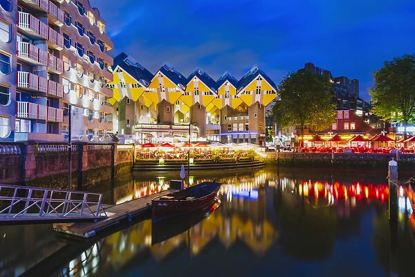 Cubic Houses (Kubuswoning) by Piet Blom, reflecting in the water canal by night in