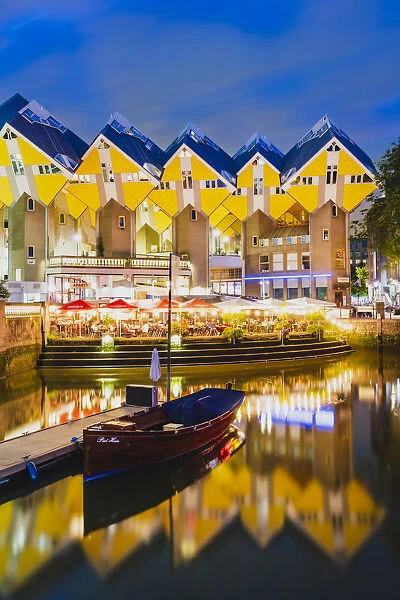 Cubic Houses (Kubuswoning) by Piet Blom, reflecting in the water canal by night in
